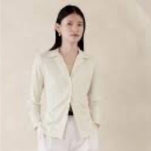 Cream stretch button up with French cuff. Fits like a US 10